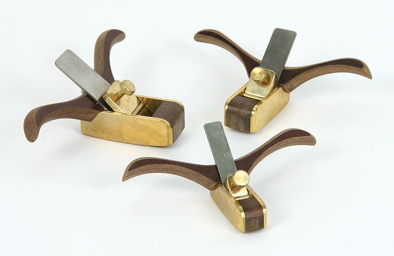 Three small brass violin maker's planes.
